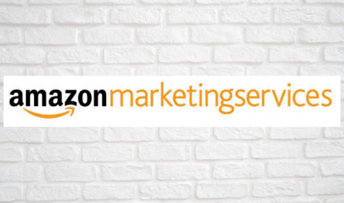 The logo of Amazon Marketing Services with a wall in the background